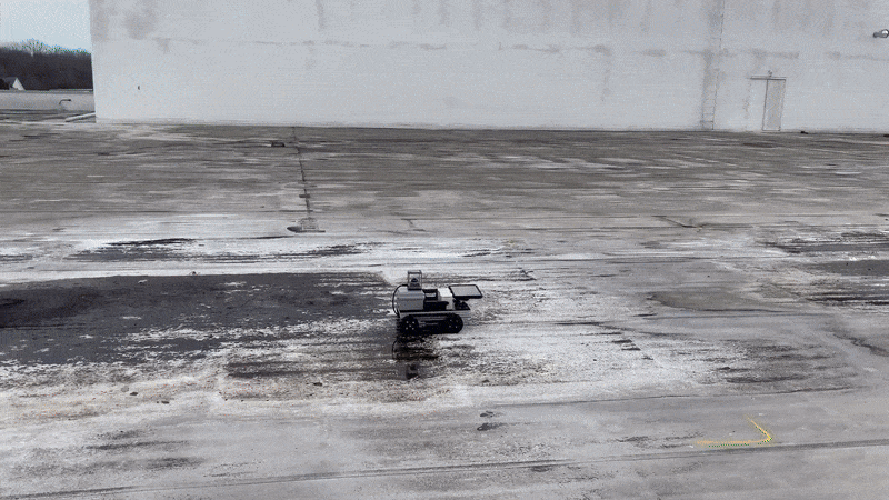 Inspection robot in action on a flat commercial roof
